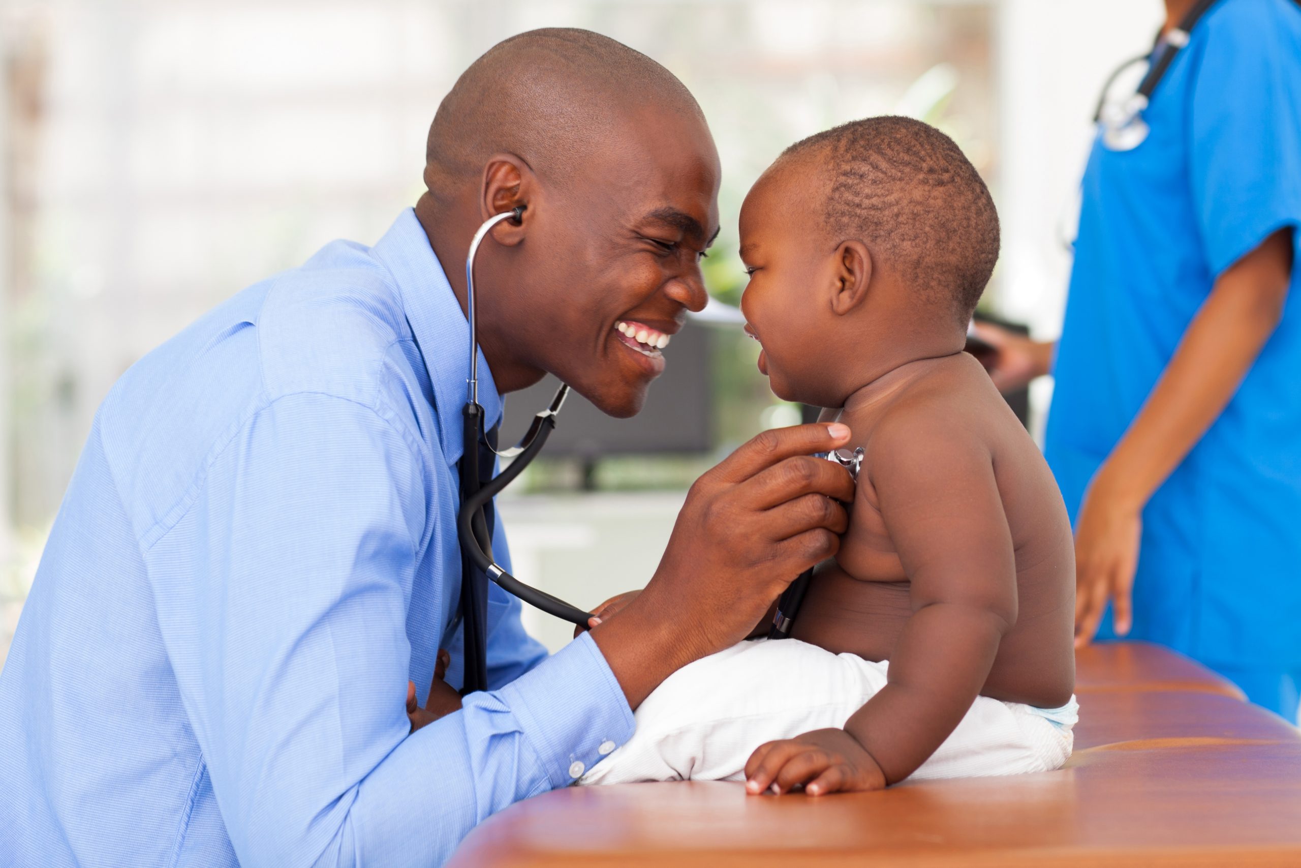 male pediatrician with male child
