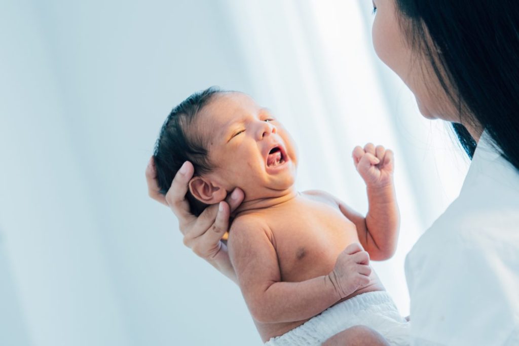 mom holding newborn baby